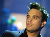 robbie williams named his new album i take the crown i to give himself a kick up the backside 