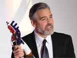 george clooney accepts german prize for humanitarian efforts
