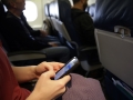 Major US carriers agree to new cellphone unlocking policy airline-passenger-mobil-120.jpg