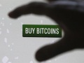 Mt. Gox suitors seek support to save Bitcoin exchange buy_bitcoins_reuters_small.jpg
