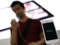 Denmark targets iPhone generation to keep edge in hearing aids man-checking-out-iphone5-reuters-120.jpg