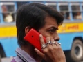 Spectrum auction February 2014: Bids total Rs. 58,332 crores by end of day seven man_talking_on_nokia_phone_reuters_small.jpg