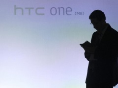 HTC Posts Fall in Q3 Revenue as Smartphone Sales Sputter man_using_htc_reuters_small.jpg