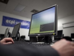 Telecom Operators Seeking Uniform Guidelines for Laying Optical Fibre man_working_on_dell_pc_reuters_small.jpg