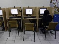 Demand for PCs Still Erratic, Outlook Unstable women_using_internet_cyber_cafe_reuters_small.jpg