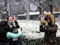 Line Confirms It's Considering an IPO in New York or Tokyo women_using_mobile_in_snow_reuters_small.jpg