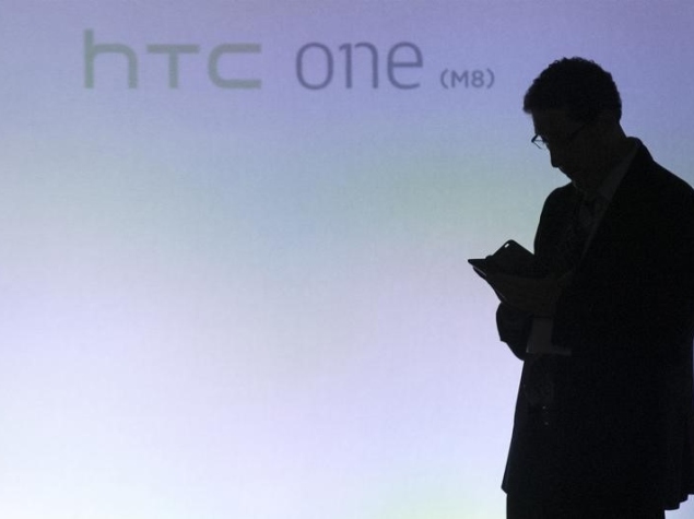 man_silhouted_htc_one_launch_reuters.jpg