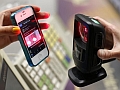 At Last, Apps for Finding Apps women_showing_sscanning_app_on_smartphone_reuters_small.jpg