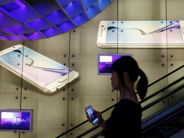 Reuters_woman_holding_iphone.jpg