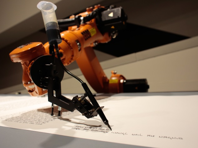 robot_writing_torah_jewish_museum_ap.jpg
