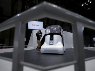 Car Makers Battle for Tech Dominance on the Road to Self-Driving Car