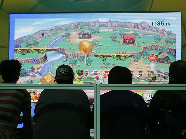 people_playing_super_mario_smash_bros_e3_2014_ap.jpg